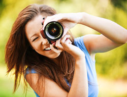 Image of a woman holding a camera